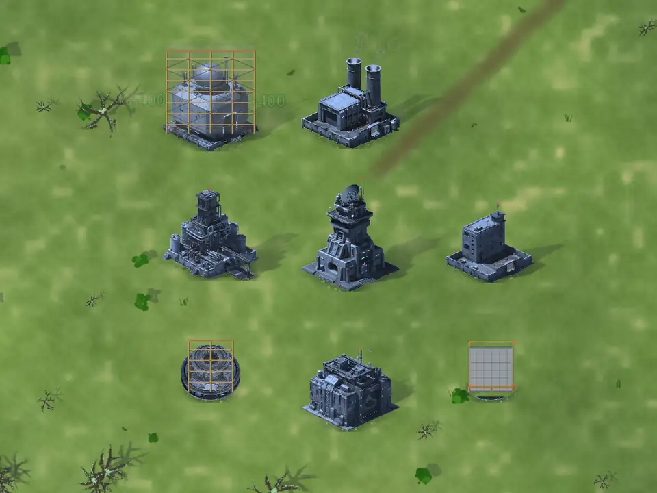 The same base seen from above on green grassland: bright grass with dark bushes and a rust-brown dirt track cutting diagonally across the frame. One building is still inside its yellow construction scaffold and two more foundations are pegged out on the ground.